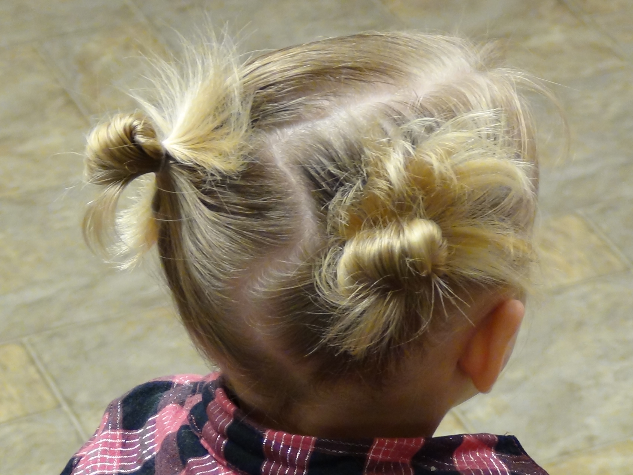 Image of High pigtails with messy buns hairstyle